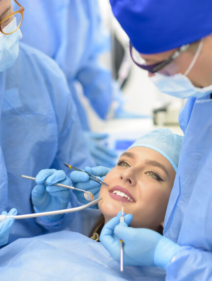 Dentists with patient having a root canal