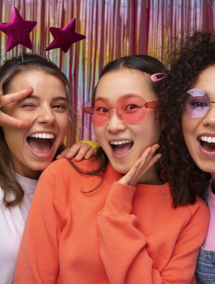 friends posing in photo booth