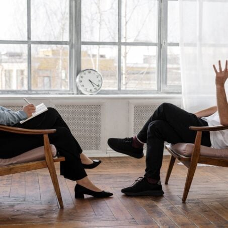 Photo by cottonbro studio: https://www.pexels.com/photo/person-in-black-pants-and-black-shoes-sitting-on-brown-wooden-chair-4101143/