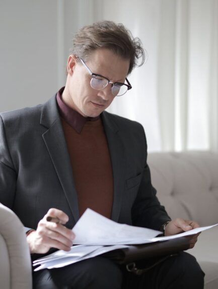 Photo by Andrea Piacquadio: https://www.pexels.com/photo/classy-executive-male-reading-papers-on-couch-3760514/