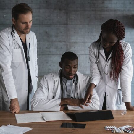 Photo by Tima Miroshnichenko: https://www.pexels.com/photo/2-men-in-white-dress-shirt-sitting-beside-brown-wooden-table-5452221/