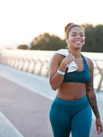 Young woman going home after running in the morning