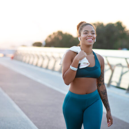 Young woman going home after running in the morning