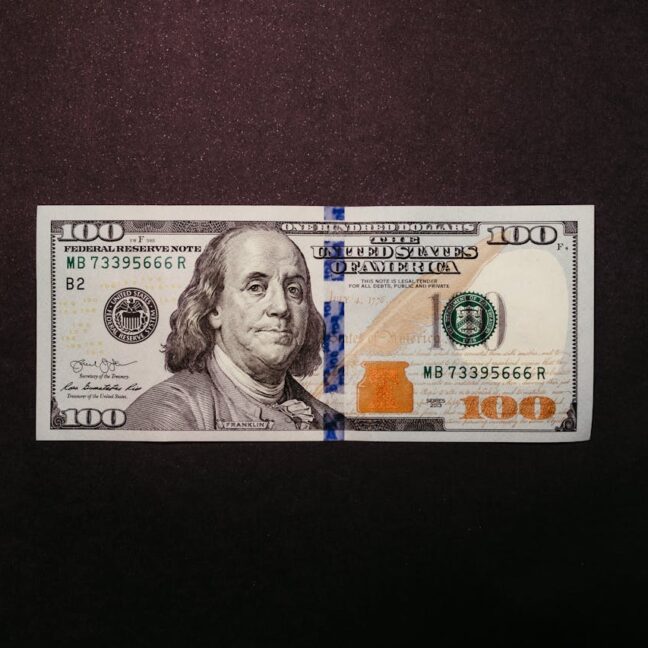 Photo by Jonathan Borba: https://www.pexels.com/photo/one-hundred-dollar-bill-on-black-background-14820467/