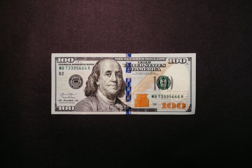 Photo by Jonathan Borba: https://www.pexels.com/photo/one-hundred-dollar-bill-on-black-background-14820467/