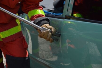 Photo by Ulrick Trappschuh: https://www.pexels.com/photo/fireman-opening-jammed-door-of-a-crushed-car-17273711/