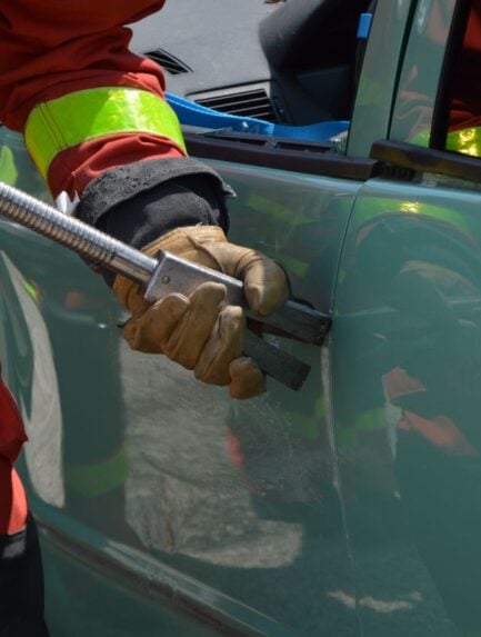 Photo by Ulrick Trappschuh: https://www.pexels.com/photo/fireman-opening-jammed-door-of-a-crushed-car-17273711/