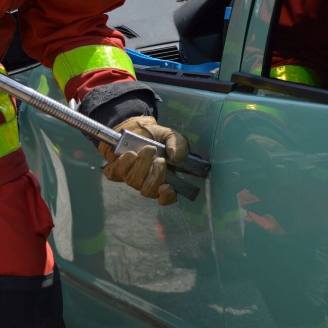Photo by Ulrick Trappschuh: https://www.pexels.com/photo/fireman-opening-jammed-door-of-a-crushed-car-17273711/